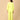 Playful pose by model wearing Lime - o - Clock Maternity and Nursing Nightwear Set from the mom store touching her belly and turned backwards