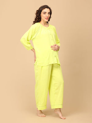 Playful pose by model wearing Lime - o - Clock Maternity and Nursing Nightwear Set from the mom store touching her belly and turned sideways