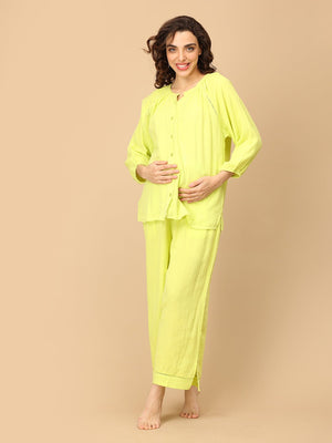 Playful pose by model wearing Lime - o - Clock Maternity and Nursing Nightwear Set from the mom store touching her belly
