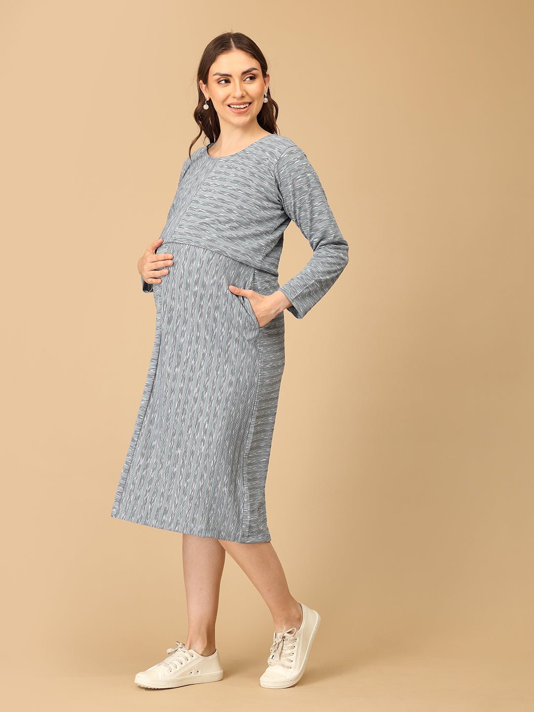 Stylish maternity and nursing dress with shrug, made from soft, breathable fabric. Features a hidden zipper for easy nursing access, sleeveless inner dress, and detachable long-sleeve shrug. Designed for comfort and versatility during and after pregnancy. Includes convenient pockets and offers a flattering fit for everyday wear.