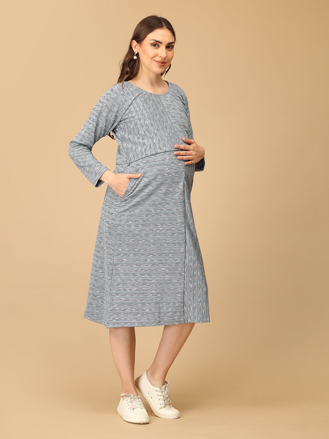 Stylish maternity and nursing dress with shrug, made from soft, breathable fabric. Features a hidden zipper for easy nursing access, sleeveless inner dress, and detachable long-sleeve shrug. Designed for comfort and versatility during and after pregnancy. Includes convenient pockets and offers a flattering fit for everyday wear.