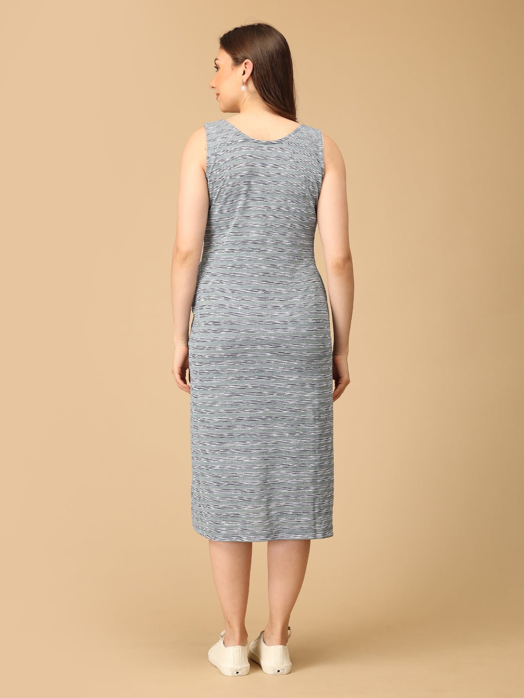 Stylish maternity and nursing dress with shrug, made from soft, breathable fabric. Features a hidden zipper for easy nursing access, sleeveless inner dress, and detachable long-sleeve shrug. Designed for comfort and versatility during and after pregnancy. Includes convenient pockets and offers a flattering fit for everyday wear.