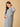 Stylish maternity and nursing dress with shrug, made from soft, breathable fabric. Features a hidden zipper for easy nursing access, sleeveless inner dress, and detachable long-sleeve shrug. Designed for comfort and versatility during and after pregnancy. Includes convenient pockets and offers a flattering fit for everyday wear.