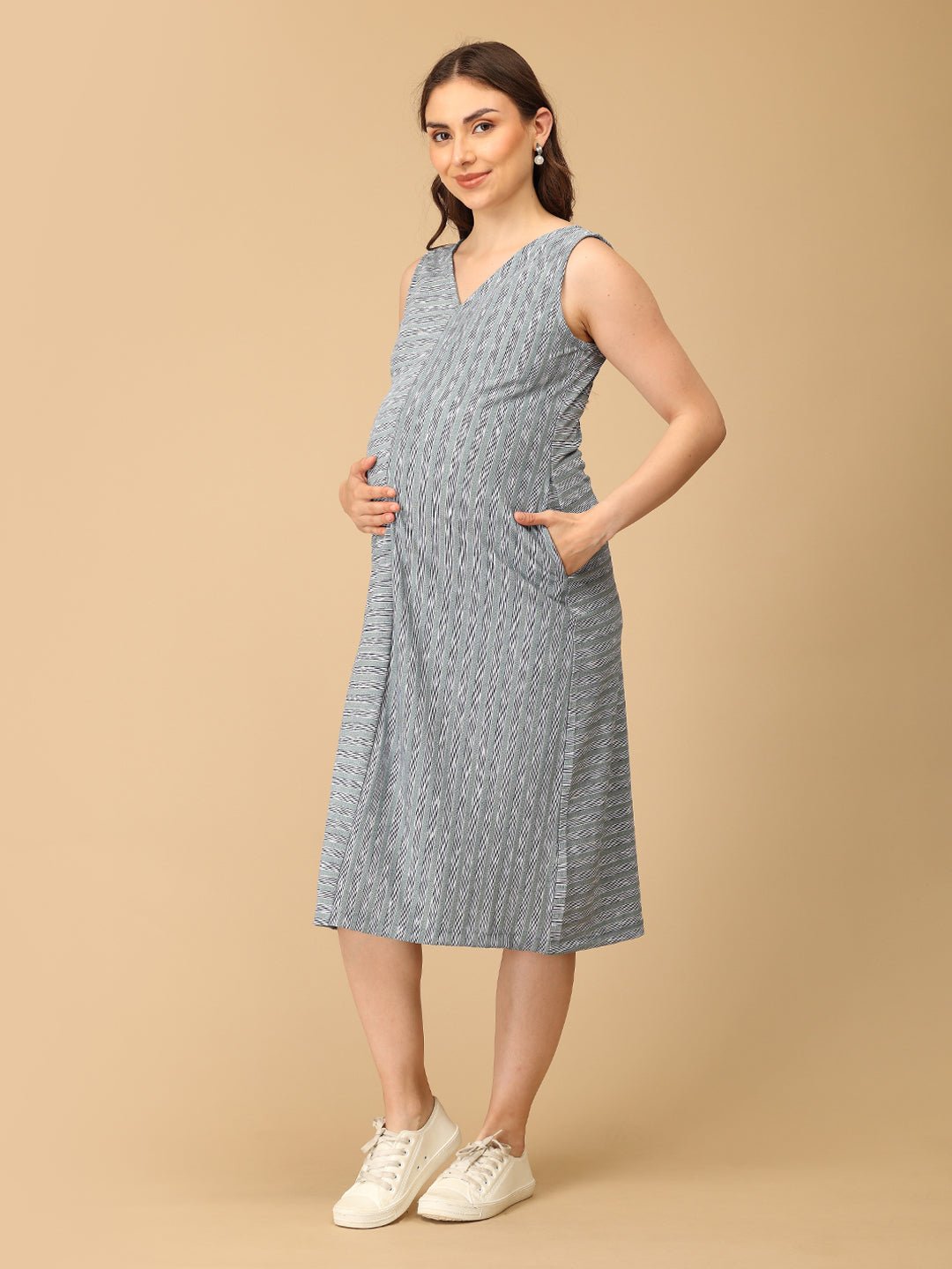 Stylish maternity and nursing dress with shrug, made from soft, breathable fabric. Features a hidden zipper for easy nursing access, sleeveless inner dress, and detachable long-sleeve shrug. Designed for comfort and versatility during and after pregnancy. Includes convenient pockets and offers a flattering fit for everyday wear.