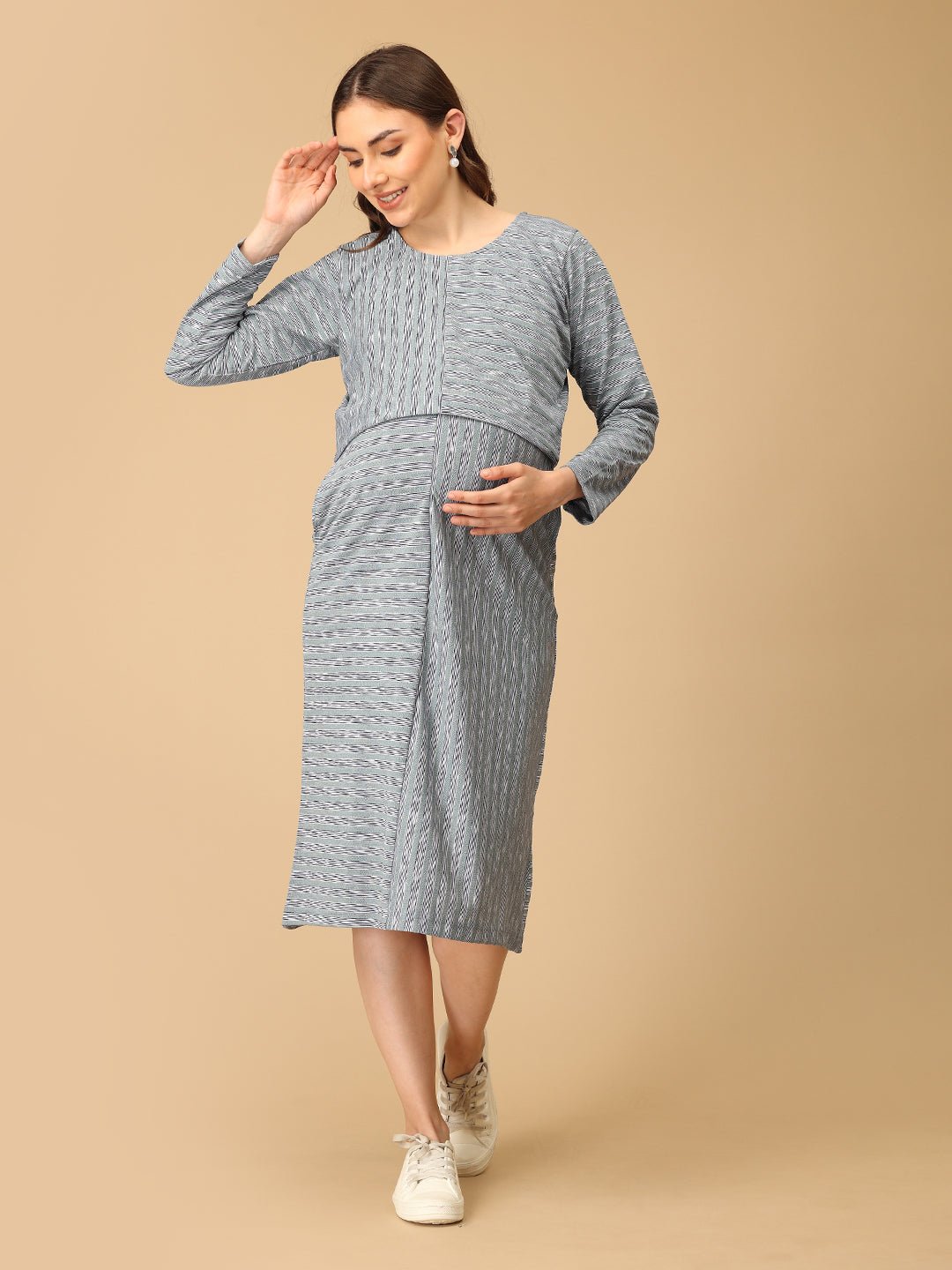 Stylish maternity and nursing dress with shrug, made from soft, breathable fabric. Features a hidden zipper for easy nursing access, sleeveless inner dress, and detachable long-sleeve shrug. Designed for comfort and versatility during and after pregnancy. Includes convenient pockets and offers a flattering fit for everyday wear.