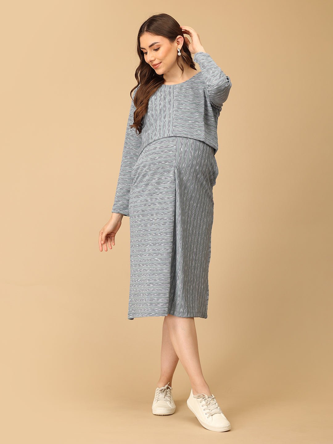 Stylish maternity and nursing dress with shrug, made from soft, breathable fabric. Features a hidden zipper for easy nursing access, sleeveless inner dress, and detachable long-sleeve shrug. Designed for comfort and versatility during and after pregnancy. Includes convenient pockets and offers a flattering fit for everyday wear.