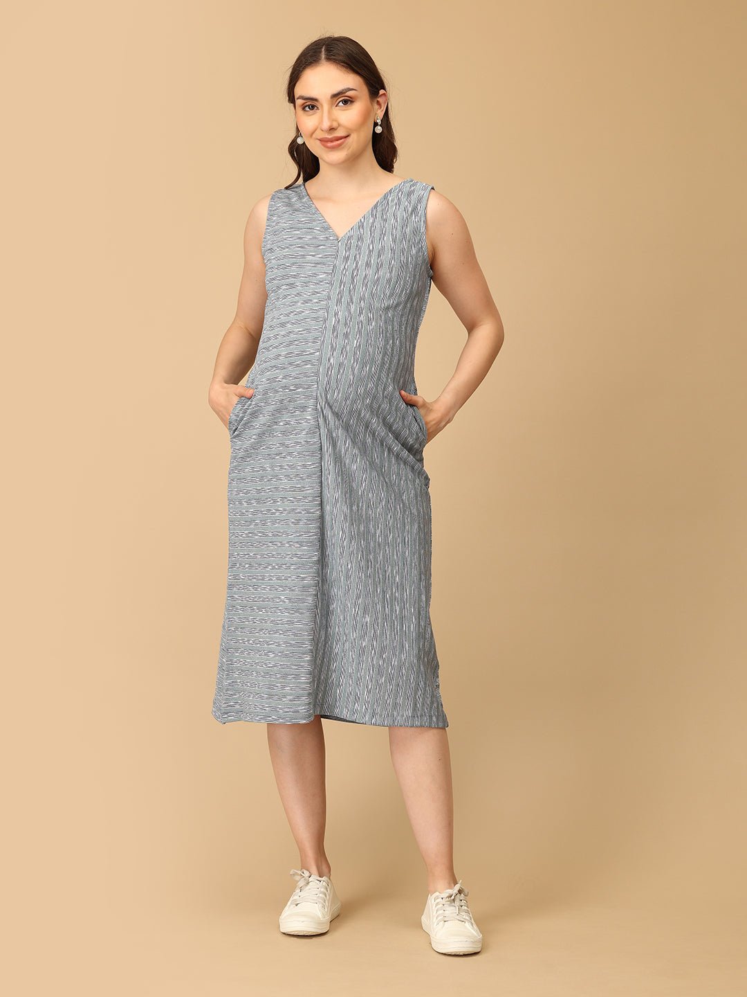 Stylish maternity and nursing dress with shrug, made from soft, breathable fabric. Features a hidden zipper for easy nursing access, sleeveless inner dress, and detachable long-sleeve shrug. Designed for comfort and versatility during and after pregnancy. Includes convenient pockets and offers a flattering fit for everyday wear.