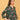 Side view of pregnant model in green floral maternity dress showing relaxed fit and side pocket detail.