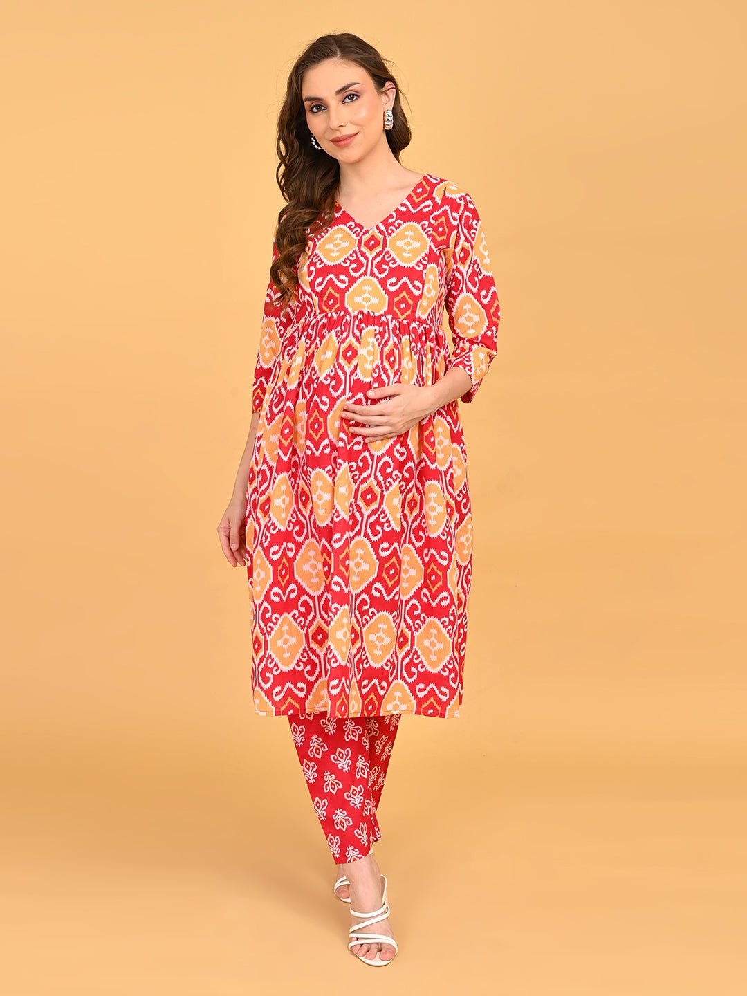 Pregnant model posing in Magenta Atelier Maternity and Nursing Kurta Set highlighting maternity-friendly design.