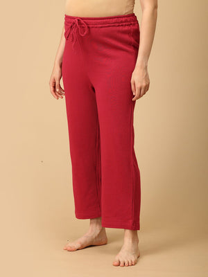 Side view of maternity pajama pants in magenta with adjustable waistband from The Mom Store.