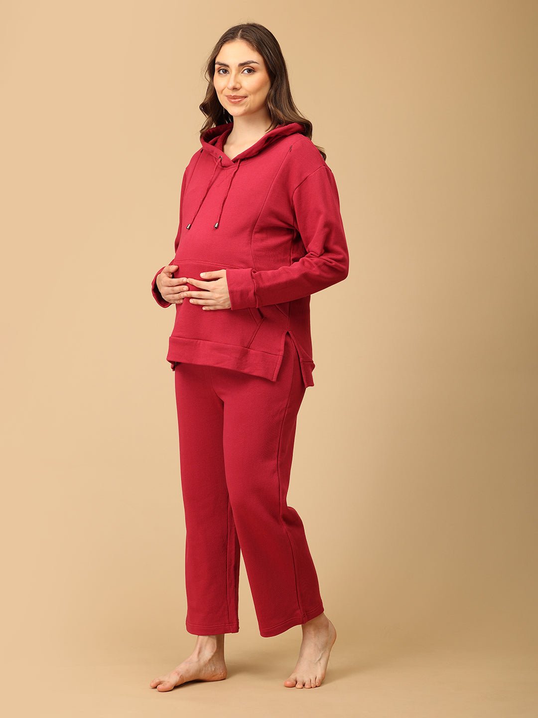 Side view of The Mom Store magenta maternity hoodie and pajama loungewear set for pregnant women.