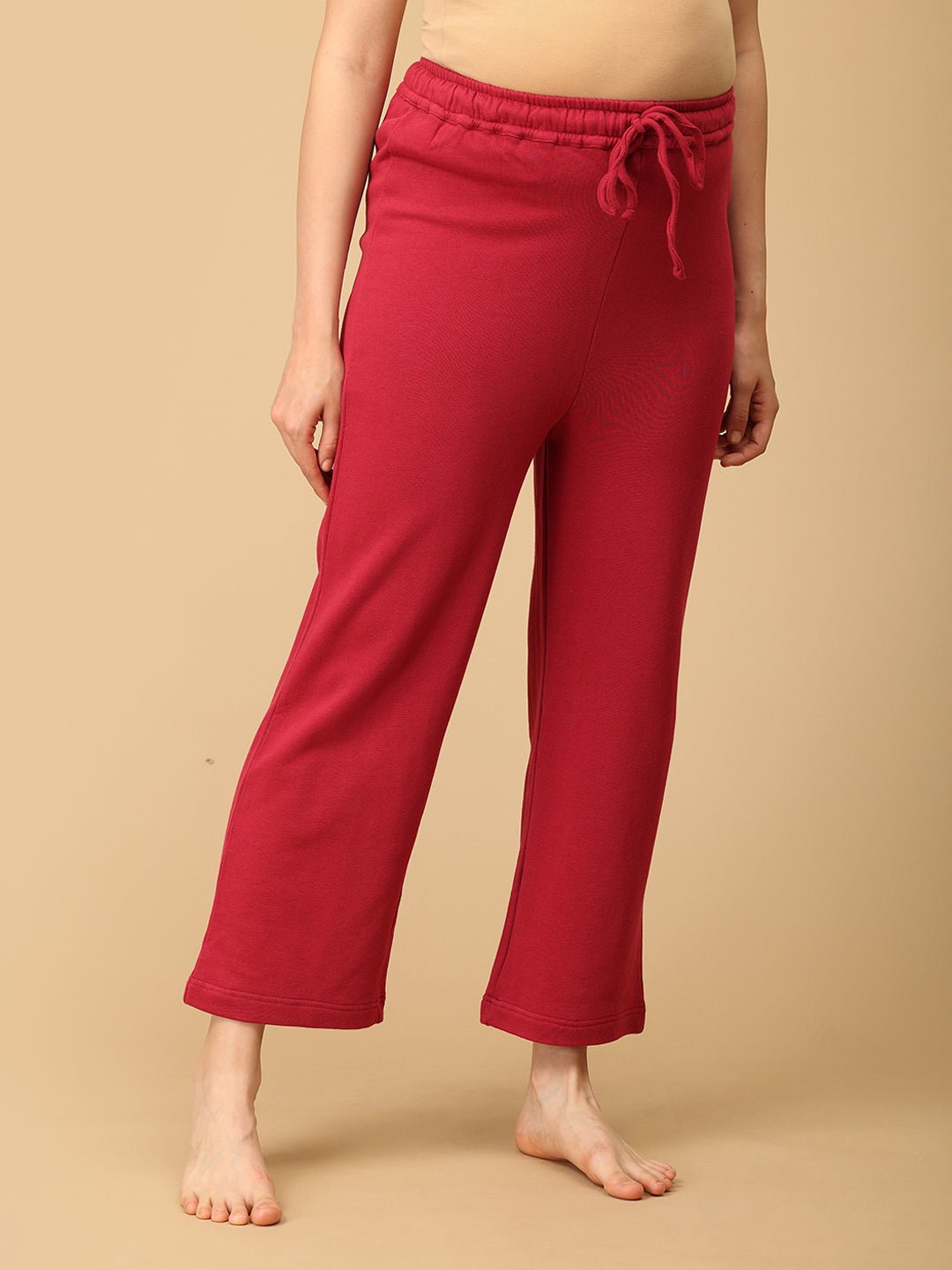 Side view of maternity pajama pants in magenta with adjustable waistband from The Mom Store.
