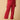 Side view of maternity pajama pants in magenta with adjustable waistband from The Mom Store.