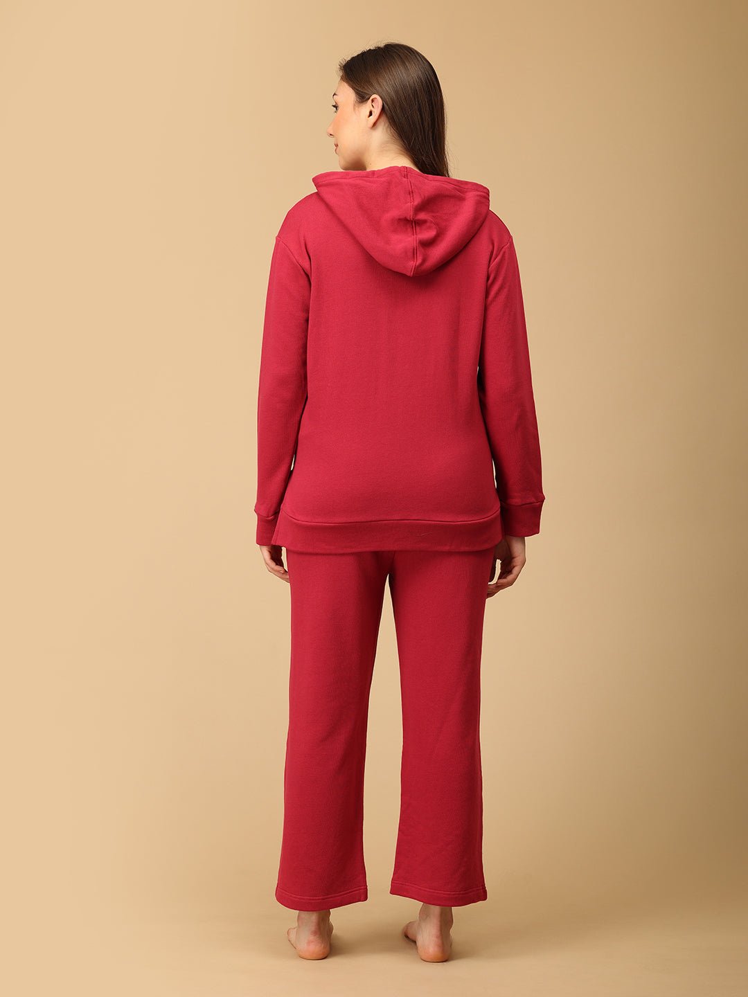 Back view of The Mom Store magenta maternity winter wear set showing relaxed fit hoodie and pants.
