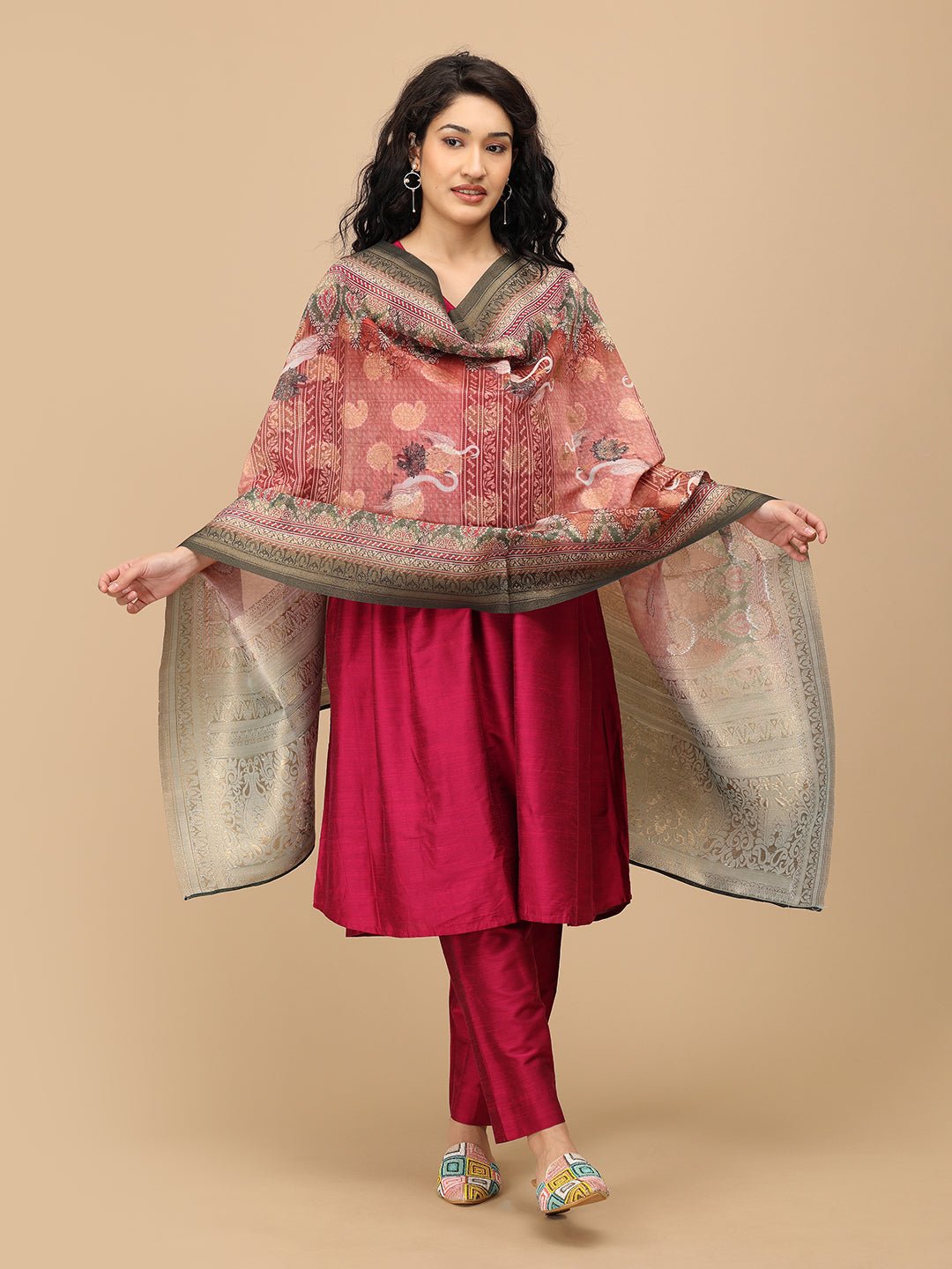 pregnant woman in The Mom Store magenta silk maternity kurta set with flowing dupatta.