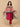 pregnant woman in The Mom Store magenta silk maternity kurta set with flowing dupatta.