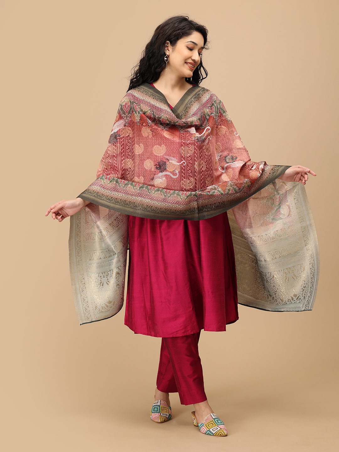 Pregnant woman in The Mom Store magenta silk maternity kurta set with printed dupatta front view.