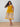 Smiling pregnant woman in bright yellow printed maternity and nursing dress ‚Äì The Mom Store.