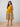 Pregnant woman wearing yellow Marigold Mirage maternity dress with paisley print ‚Äì The Mom Store.