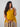 Expecting mom wearing sleeveless yellow maternity dress with paisley border ‚Äì The Mom Store.