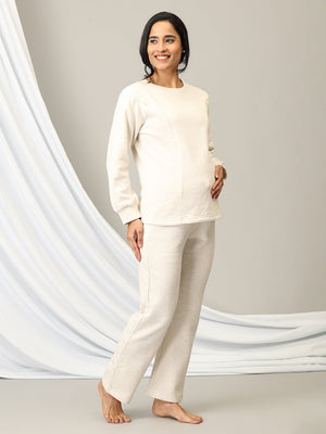 Pregnant model wearing Marshmallow Maternity and Feeding Pajama Loungewear Set from the mom store turned sideways