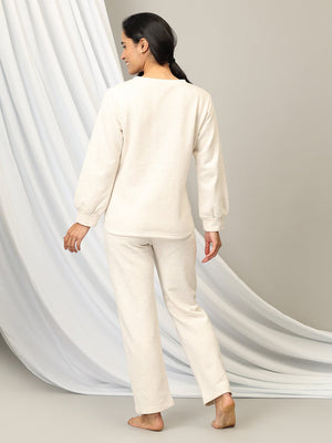 Pregnant model wearing Marshmallow Maternity and Feeding Pajama Loungewear Set from the mom store turned backwards