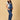 Side view of pregnant woman in The Mom Store Maternity Blue Denim Dungaree with Side Buttons 