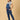Side pose of pregnant woman in The Mom Store blue Denim Maternity Dungaree with Side Buttons 