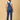 back view of pregnant woman in The Mom Store blue Denim Maternity Dungaree with Side Buttons 