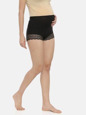 Right Sidepose by Model wearing black coloured Mama Over Belly Support Panties from the Mom Store