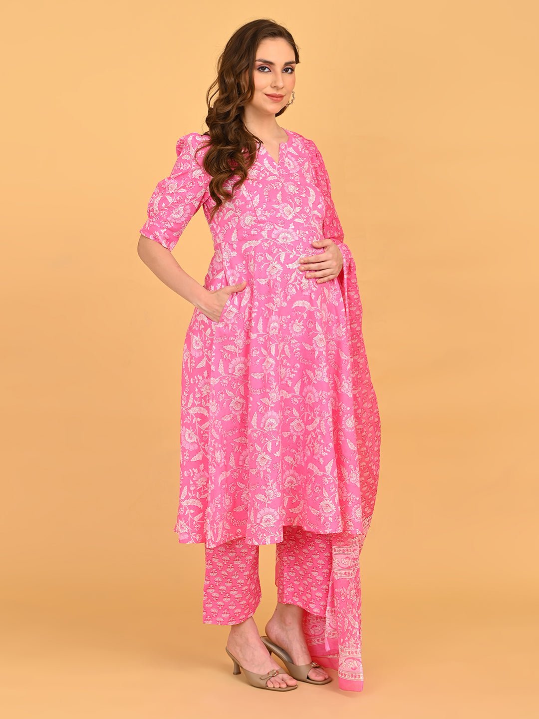 Angled front pose of pink maternity kurta set with flowing dupatta and bump-friendly silhouette.