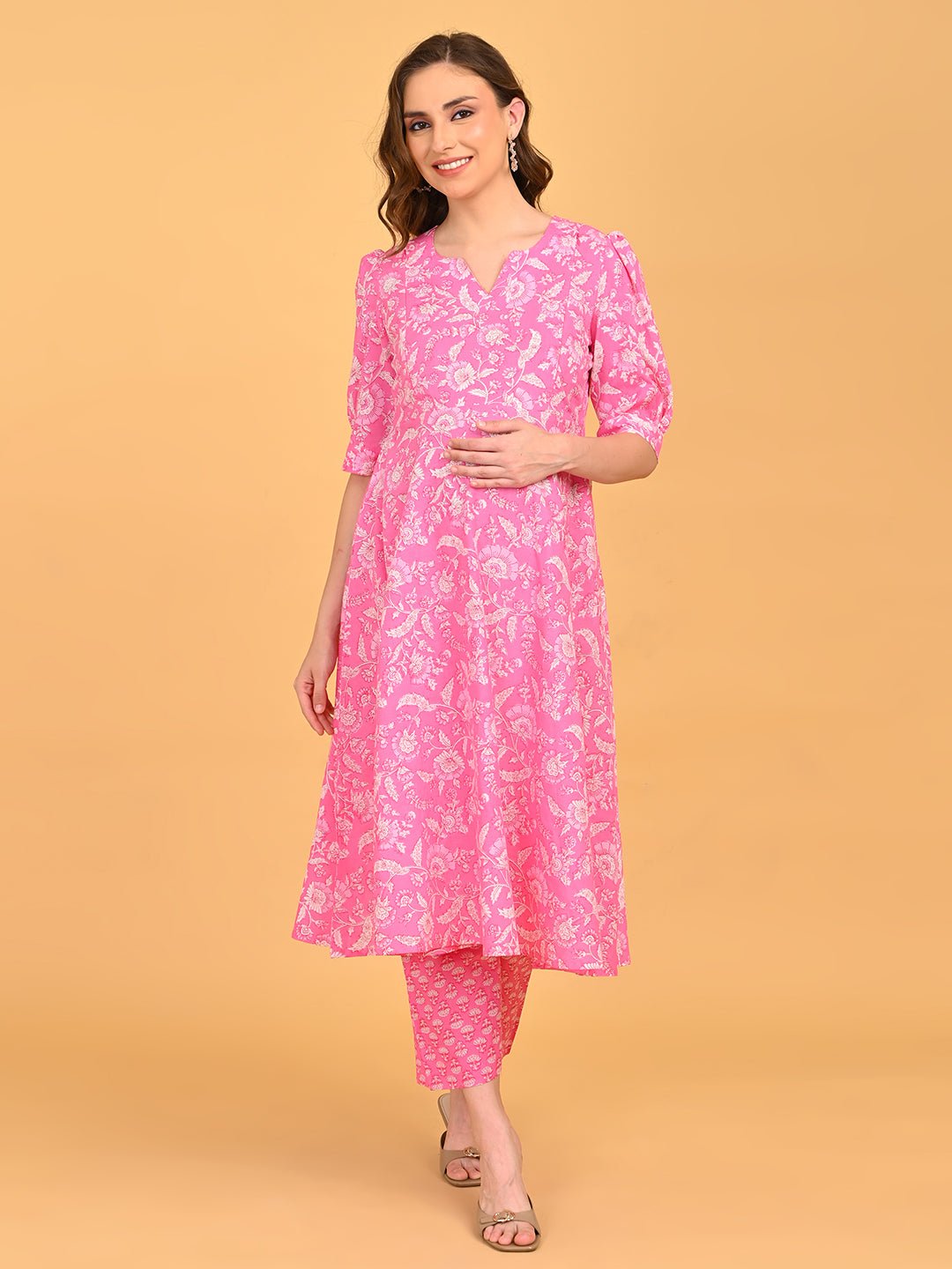Model wearing pink floral ShyamAab maternity and nursing kurta set with matching printed pants.