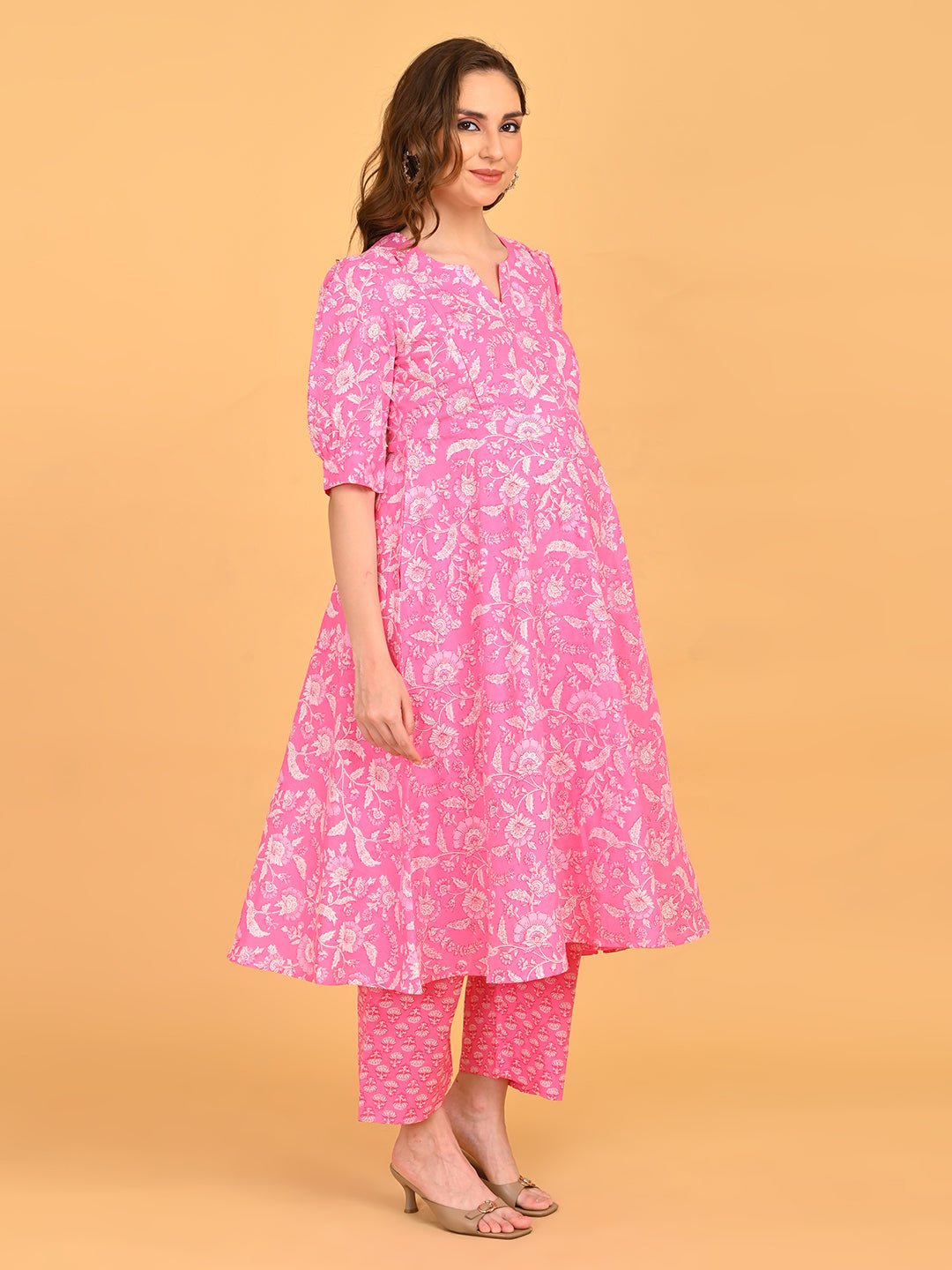 Angled front pose of pink maternity kurta set with flowing dupatta and bump-friendly silhouette.