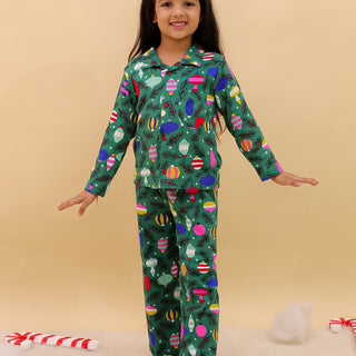 The Mom Store Merry Snuggle Squad Christmas Kids Pajama Set – cozy green winter sleepwear for festive comfort.