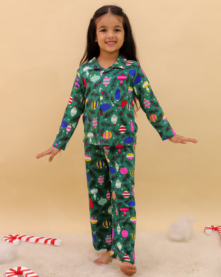 The Mom Store Merry Snuggle Squad Christmas Kids Pajama Set – cozy green winter sleepwear for festive comfort.