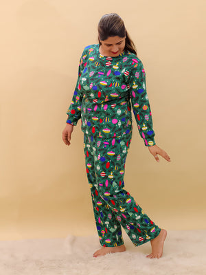 Playful pose by Pregnant model wearing Merry Snuggle Squad Maternity Pajama Set from the mom store
