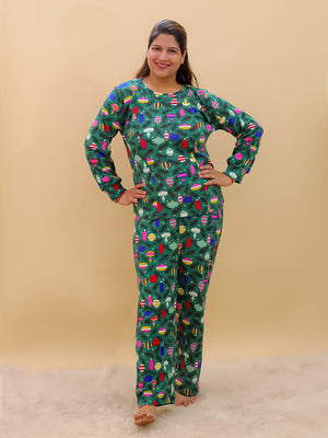Playful pose by Pregnant model wearing Merry Snuggle Squad Maternity Pajama Set from the mom store