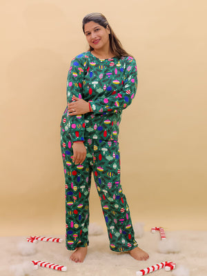 Playful pose by Pregnant model wearing Merry Snuggle Squad Maternity Pajama Set from the mom store