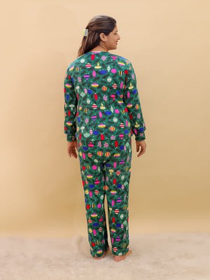 Playful pose by Pregnant model wearing Merry Snuggle Squad Maternity Pajama Set from the mom store facing backwards