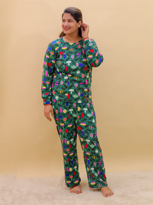 Playful pose by Pregnant model wearing Merry Snuggle Squad Maternity Pajama Set from the mom store