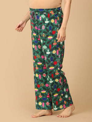 Close up of trousers of Pregnant model wearing Merry Snuggle Squad Maternity Pajama Set from the mom store from the side
