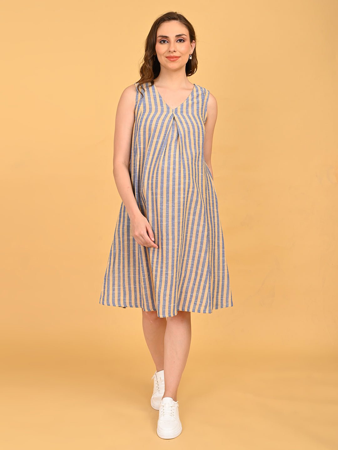 Modern Loom Maternity and Nursing Shacket Dress front pose with hand in pocket showing relaxed maternity fit of striped dress.
