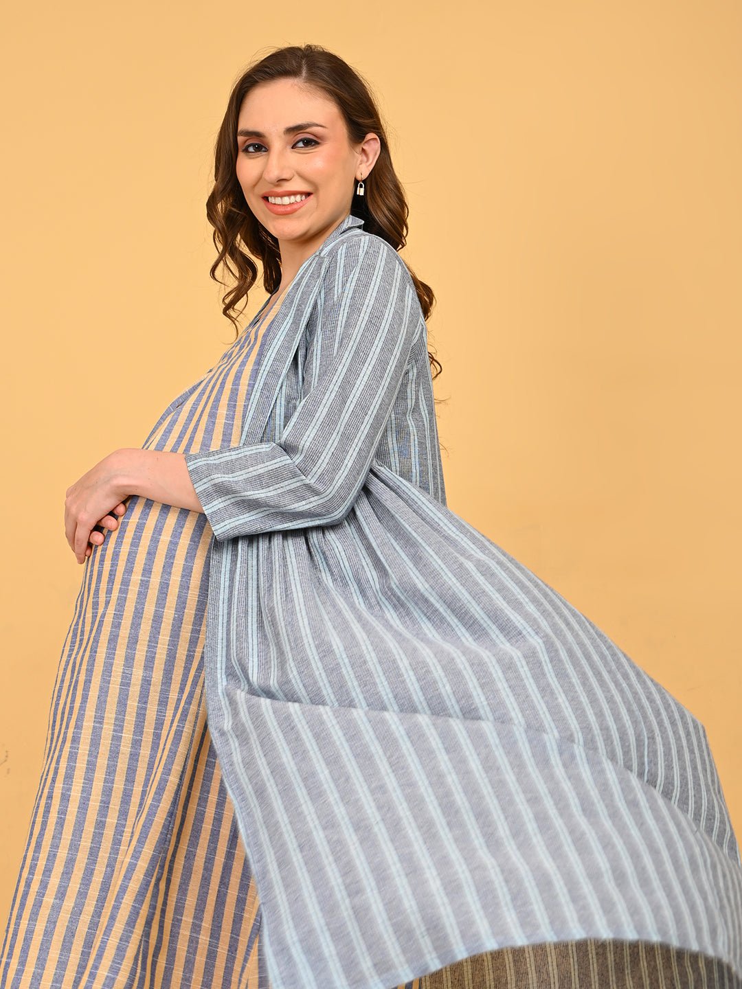 Modern Loom Maternity and Nursing Shacket Dress mid-length portrait showing lapel collar shacket and striped maternity dress underneath.