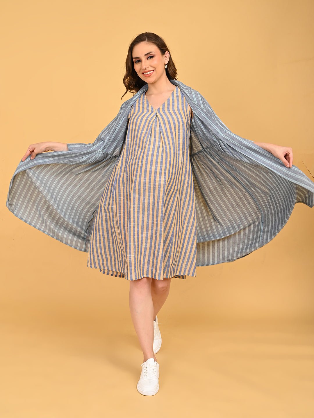 Modern Loom Maternity and Nursing Shacket Dress playful pose with model spreading shacket to reveal striped maternity dress.