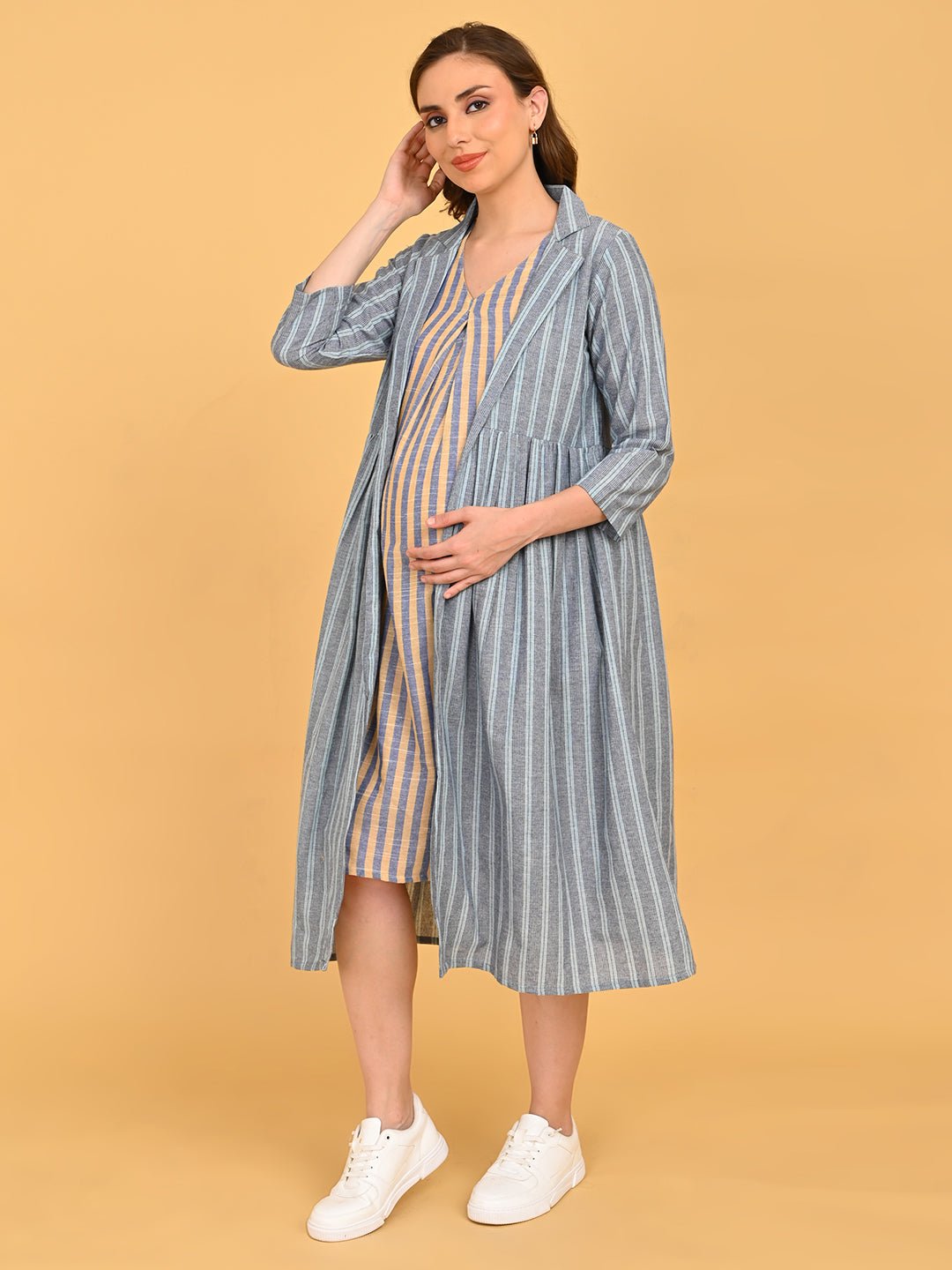 Modern Loom Maternity and Nursing Shacket Dress angled front pose with model cradling baby bump, showcasing layered dress and shacket styling.