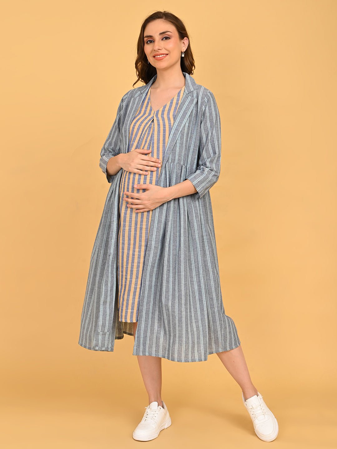 Modern Loom Maternity and Nursing Shacket Dress full-length front view of model wearing striped maternity dress with open shacket and white sneakers.