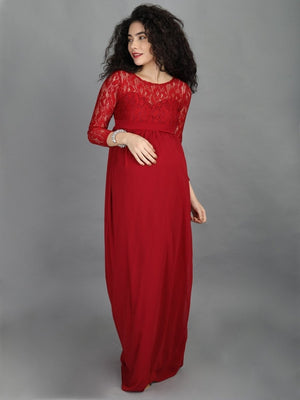 A visibly pregnant model wearing mulberry coloured, maternity maxi dress from The Mom Store 