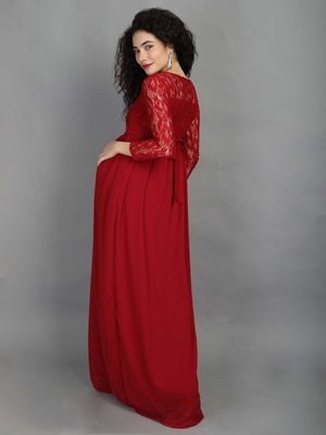back profile of pregnant model wearing mulberry coloured, maternity maxi dress from The Mom Store, touching her bump.