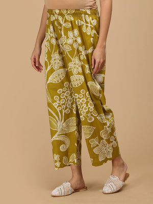 Angled view of mustard floral maternity pants showing relaxed fit and breathable fabric.