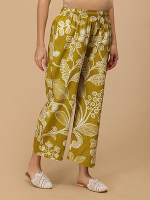 Angled view of mustard floral maternity pants showing relaxed fit and breathable fabric.